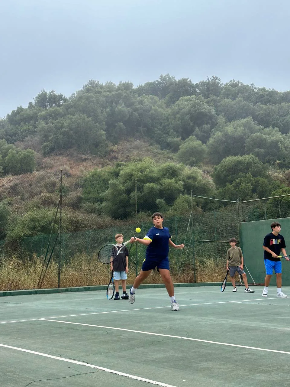 Adult tennis player practising at Rhino Tennis Academy